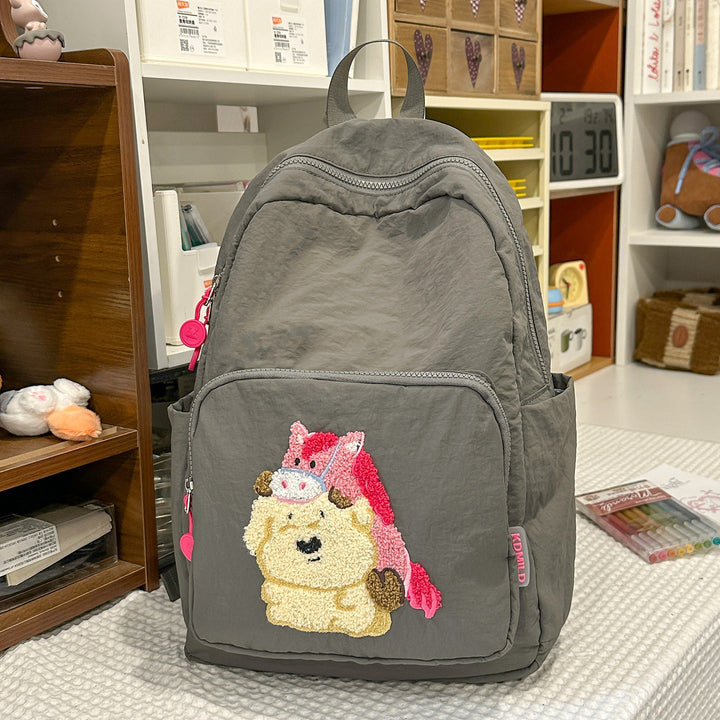Embroidered cartoon school backpack, a cute & practical daily bag for children. Great for school & travel.