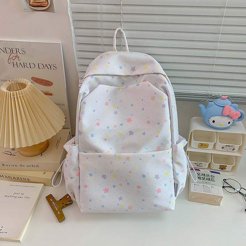 Unisex casual backpack with a vibrant star pattern, perfect for school or daily use. Stylish and practical.