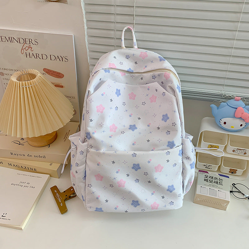 Modern unisex backpack featuring an eye-catching star pattern, suitable for daily use, school, or travel.