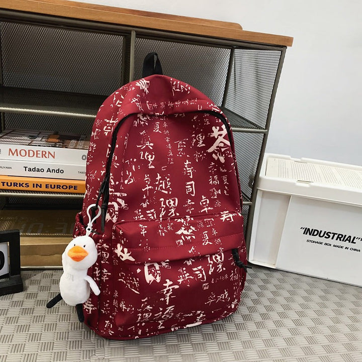 Artistic script print polyester daypack. This casual unisex backpack is a trendy fashion accessory for travel.