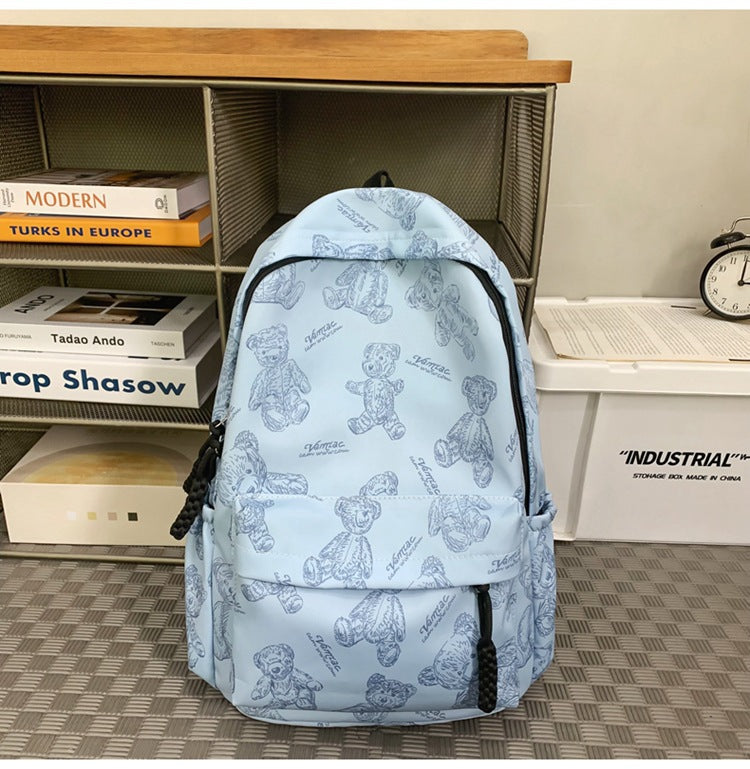 Unisex casual backpack with playful teddy bear print. Ideal for students & everyday use. Durable & stylish.