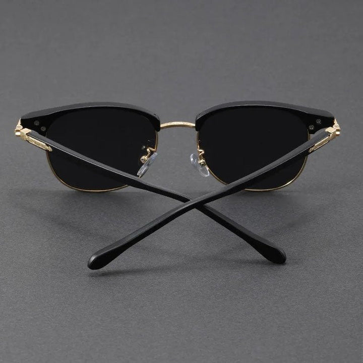 Stylish Clubmaster half-frame UV400 metal sunglasses, a vintage-inspired fashion accessory.