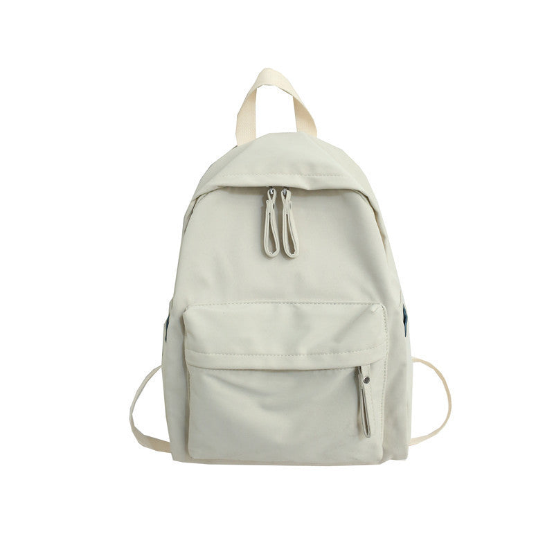 Versatile compact unisex travel backpack, ideal for daily commutes or light adventures, with a sleek, durable design.