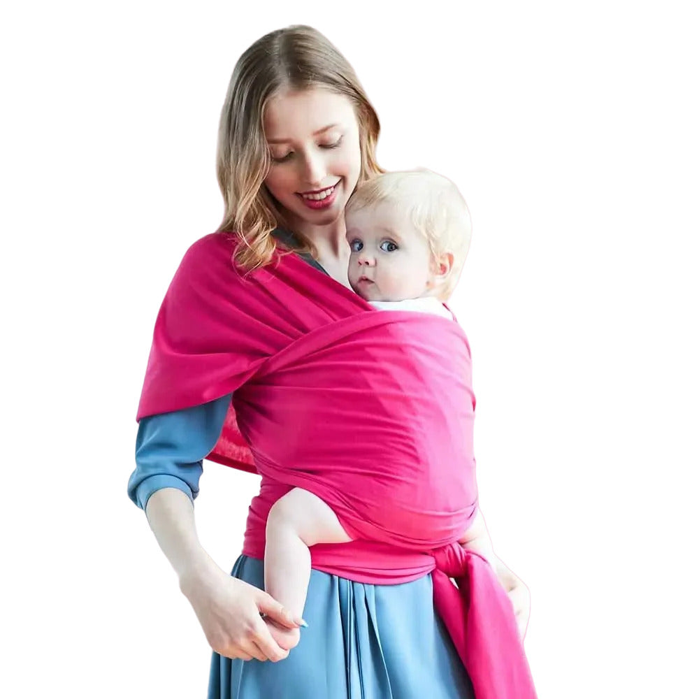 Parent wearing a soft cotton baby wrap carrier, keeping their infant close and secure for comfortable, hands-free parenting.
