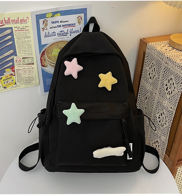 Unisex cute star-embellished backpack, perfect school bag or travel accessory with playful colorful design.