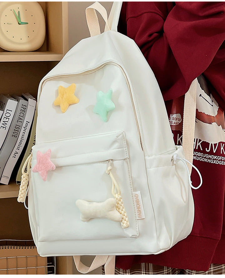 Playful colorful unisex backpack featuring cute star embellishments, a stylish and durable everyday accessory.
