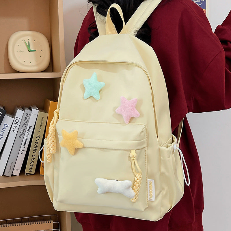 Cute unisex backpack adorned with vibrant stars, a trendy school bag and playful travel accessory for all ages.