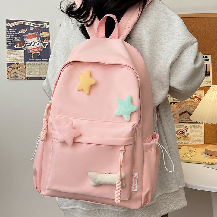 Versatile unisex backpack with playful star design, a durable and colorful school bag, travel pack, or everyday accessory.