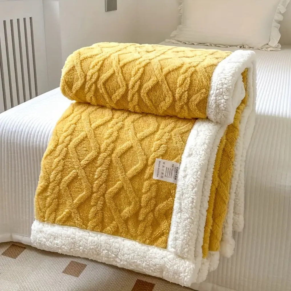 Plush diamond knit sherpa blanket, perfect for adding cozy comfort to any room.