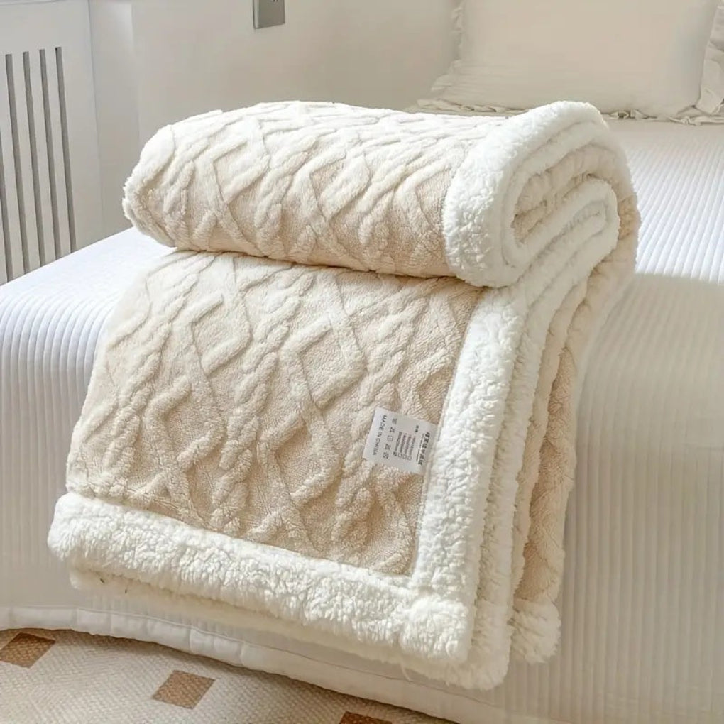 Cozy diamond knit sherpa throw, a reversible plush fleece blanket for living room or bedroom.