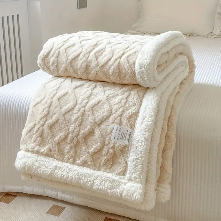 Cozy diamond knit sherpa throw, a reversible plush fleece blanket for living room or bedroom.