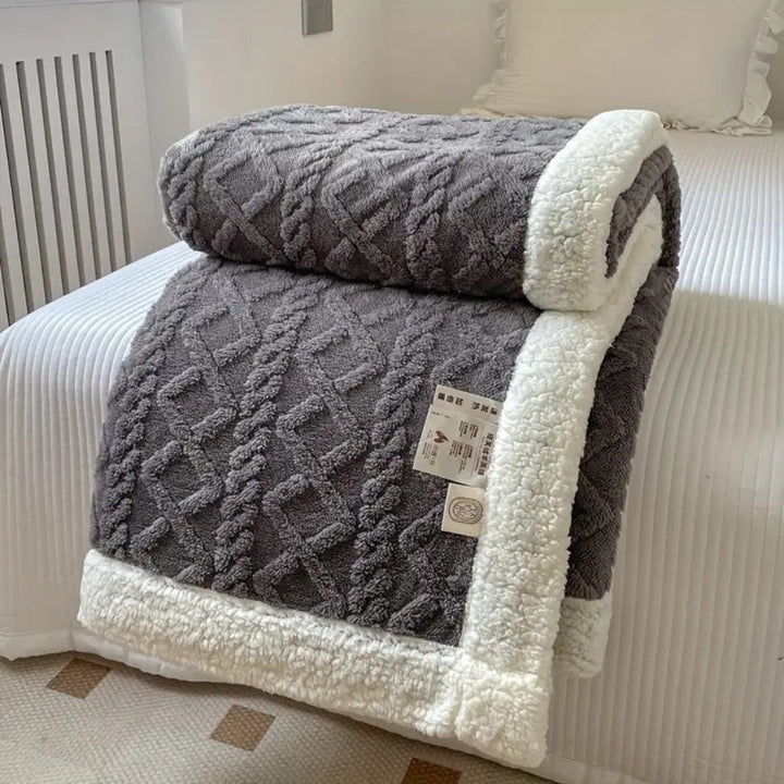 Stylish diamond knit sherpa blanket, a soft and cozy fleece throw for ultimate relaxation.