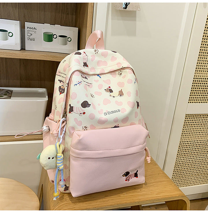 Unisex dog lover graphic backpack with playful puppy print, perfect for school or travel. Durable everyday bag.