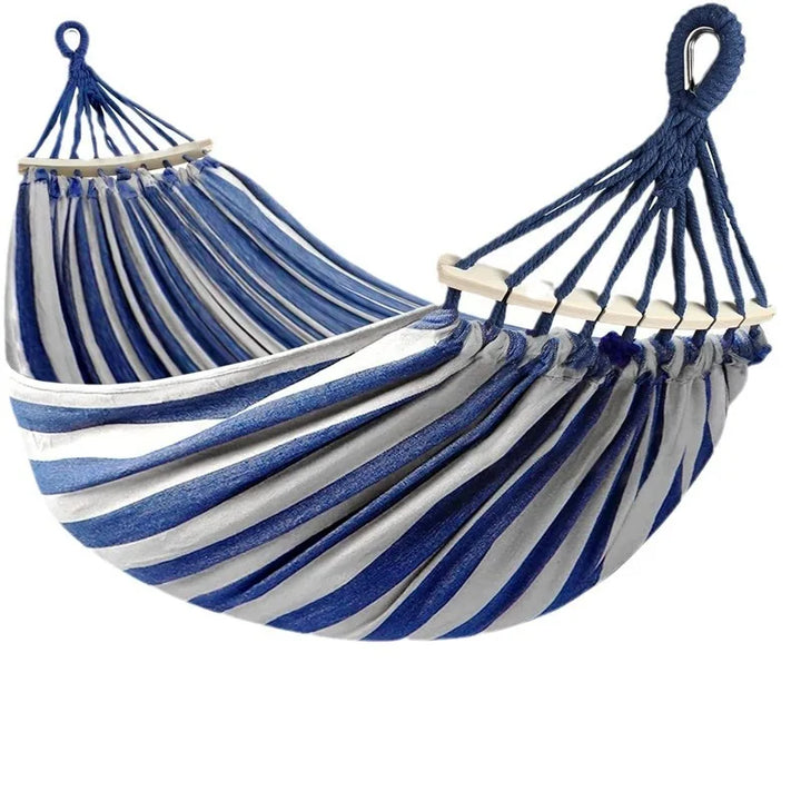 Durable double canvas hammock with wooden spreaders for versatile outdoor relaxation, camping, or patio lounging.