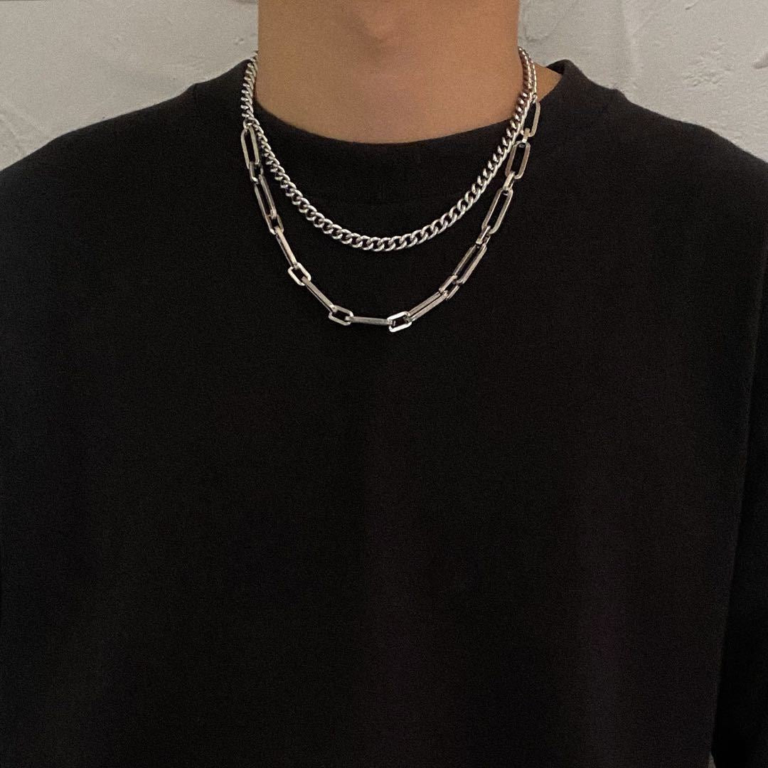 Unisex dual-layer link chain necklace crafted from polished stainless steel. Modern, minimalist jewelry for versatile styling.