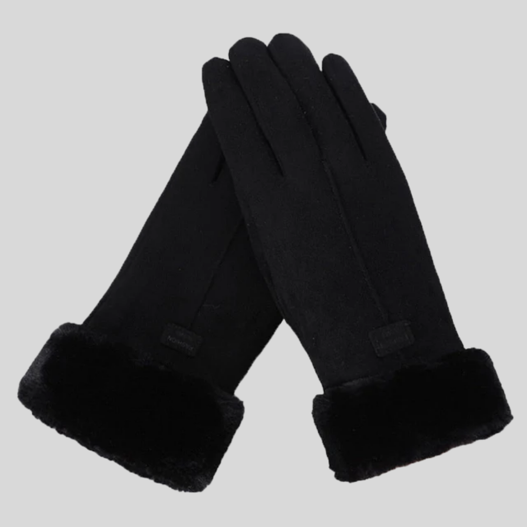Person wearing durable unisex winter gloves while hiking in snow, ideal for cold weather outdoor activities.