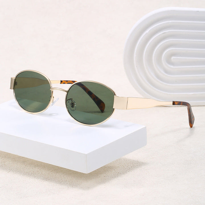 Unisex elegant oval sunglasses with sleek metal frame. Stylish eyewear for fashion & UV eye protection.