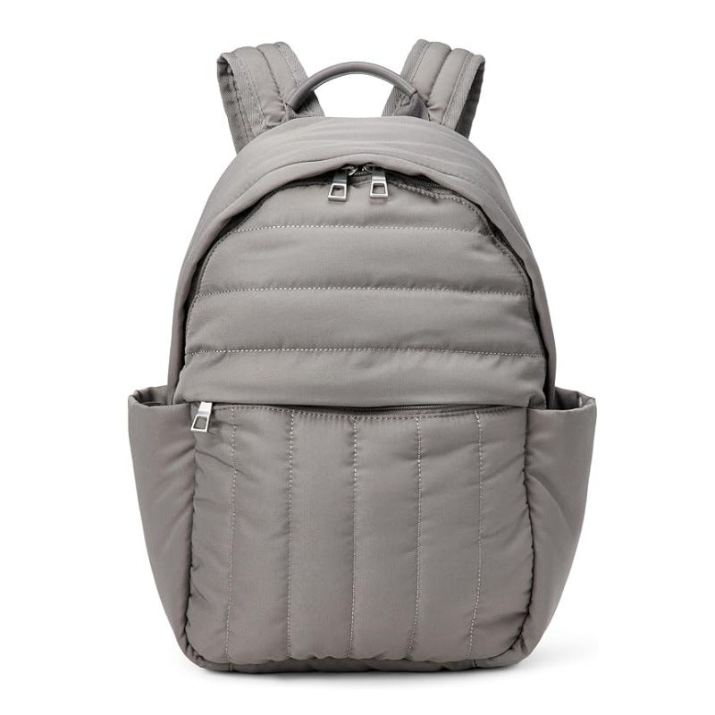 Versatile gray ergonomic backpack, perfect for daily carry, featuring anti-theft pocket and secure laptop compartment.