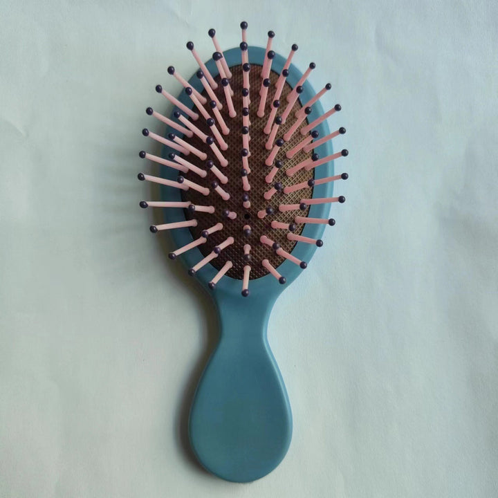 Styling essential: ergonomic detangling brush for sleek, shiny hair results.