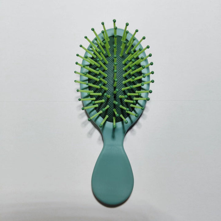 Detangling & straightening brush, ergonomic handle for comfortable, effective use.