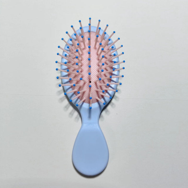 Ergonomic detangler brush, designed for easy hair care & frizz control.