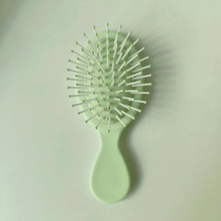 Hair care essential: detangling & straightening brush for frizz-free, shiny locks.