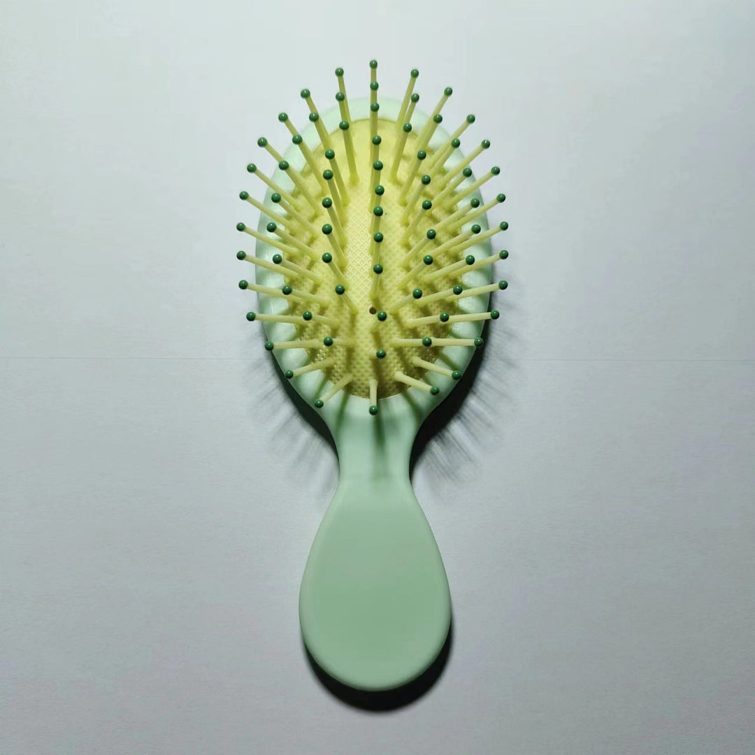 Straightening paddle brush with ergonomic grip for healthy & shiny, tangle-free hair.