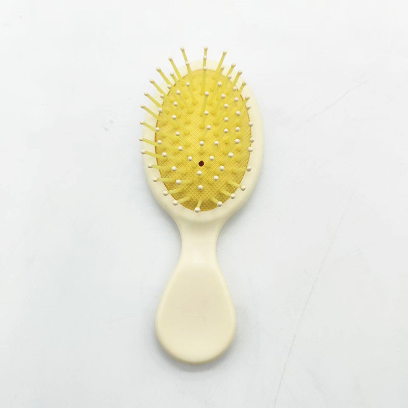 Unisex detangler brush, ideal for all hair types, offering easy hair care.