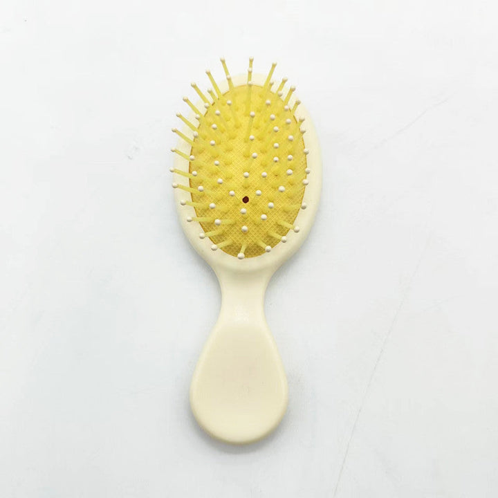 Unisex detangler brush, ideal for all hair types, offering easy hair care.