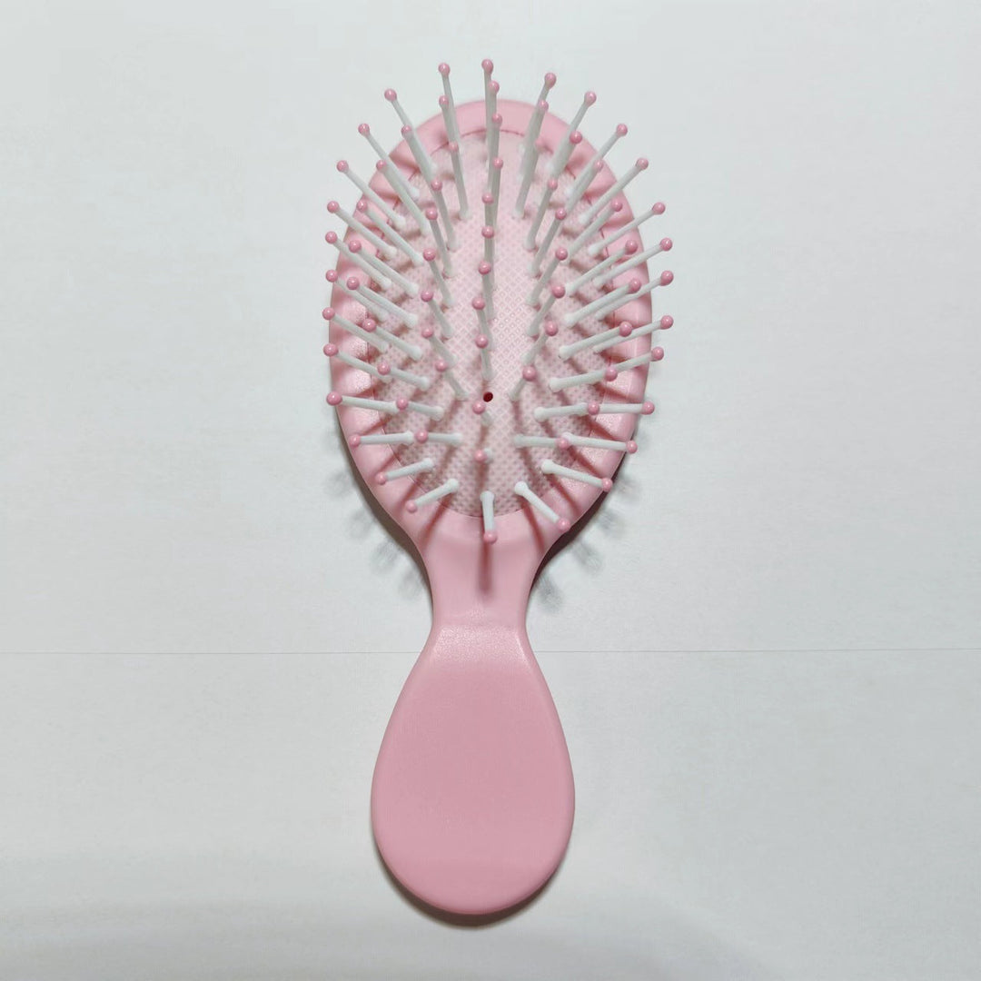 Gentle detangling brush, ergonomic design for comfortable & effective hair styling.