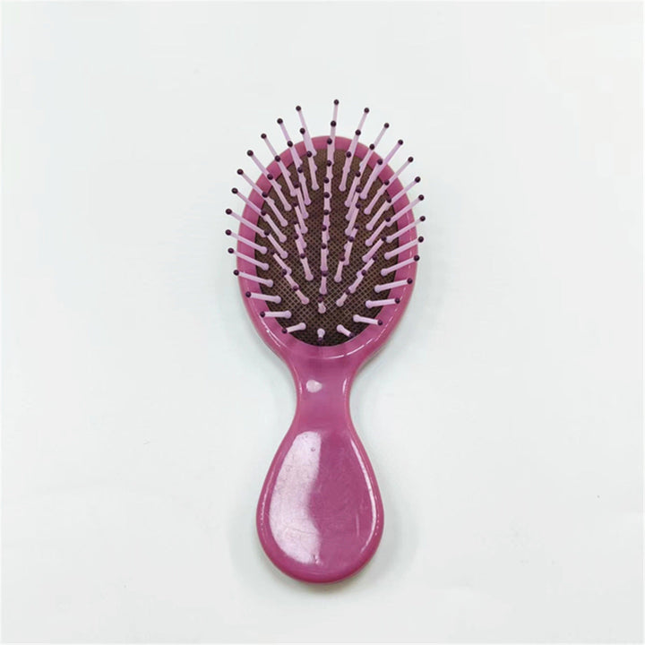 Ergonomic handle hair comb with gentle teeth for effective detangling & smooth styling.
