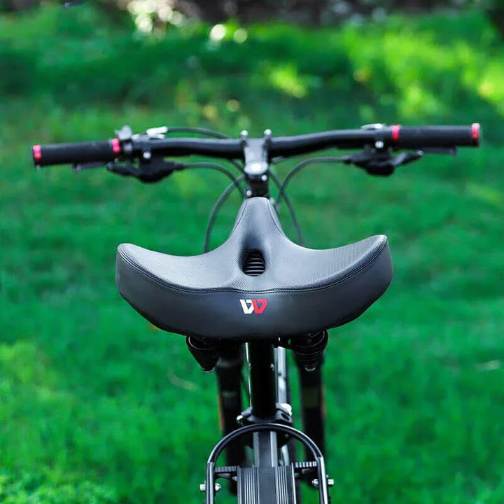 Ergonomic bike saddle with extra thick padding, designed wide for comfortable cycling and pressure relief.