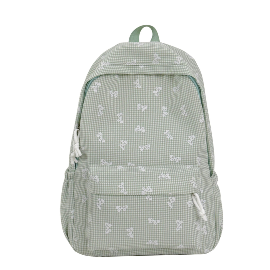Playful bow print backpack for everyday use. Unisex, comfortable, and durable school or travel bag.