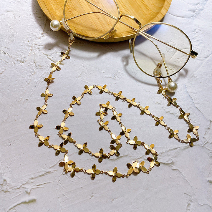 Chic glasses holder chain featuring delicate flower pendants. A trendy unisex eyewear accessory & gift idea.