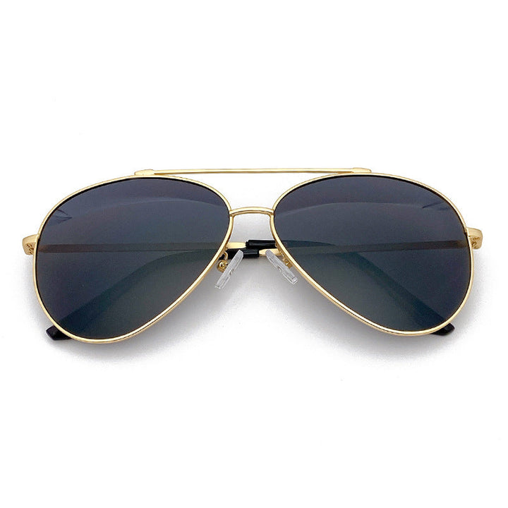 Gold frame pilot sunglasses, dark lenses; perfect unisex fashion shades for summer UV eye protection.