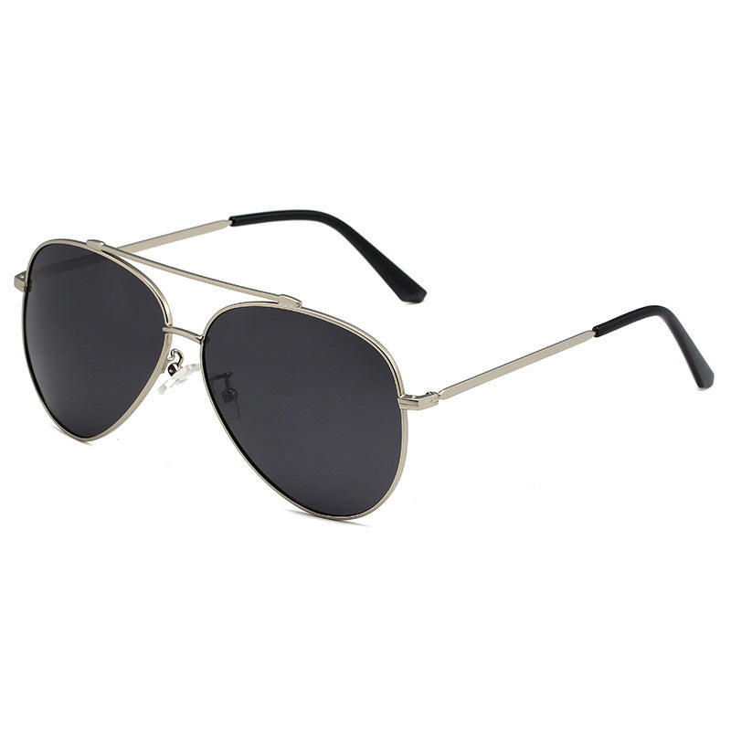 Unisex pilot sunglasses with sleek gold frames & dark UV protective lenses; trendy aviator style for all seasons.