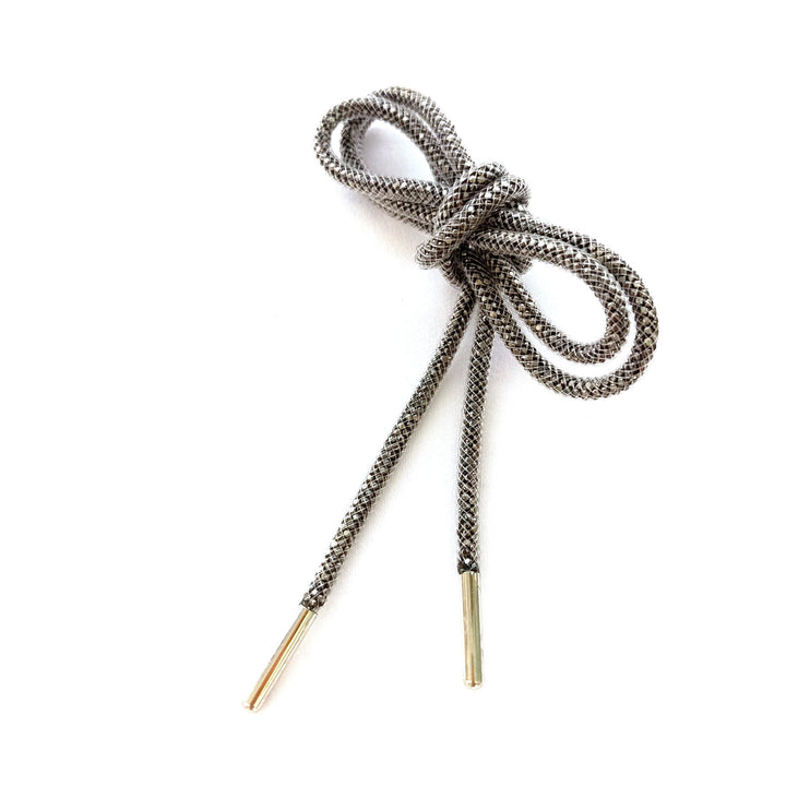 Reflective grey shoe laces, offering style & safety for night-time running or casual wear. Durable laces.