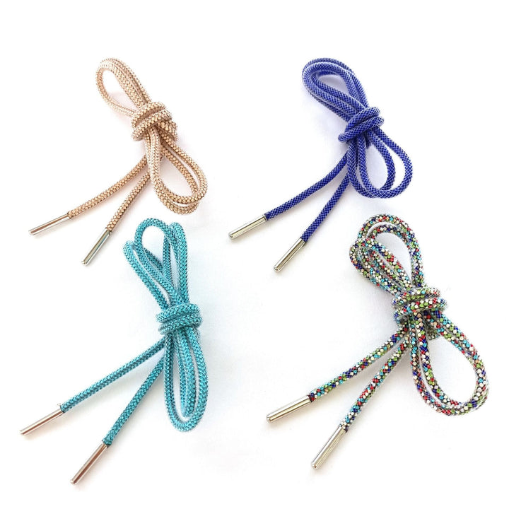 Colorful rounded shoe laces for athletic sneakers, adding a pop of style. High-quality footwear accessory.