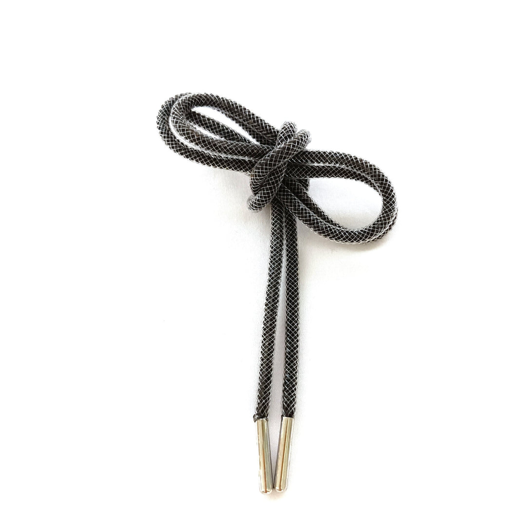 High-quality grey shoe laces, designed for durability and a sleek look on any footwear. Essential accessory.