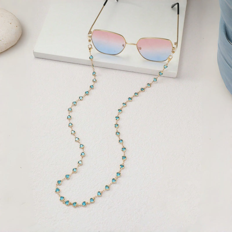 Keep glasses safe with this stylish blue stone sunglasses chain, a practical fashion accessory.