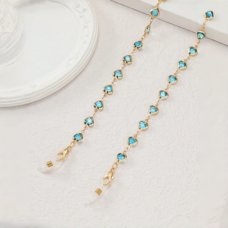 Elegant blue stone glasses holder chain. Secure and stylish eyewear accessory for all.