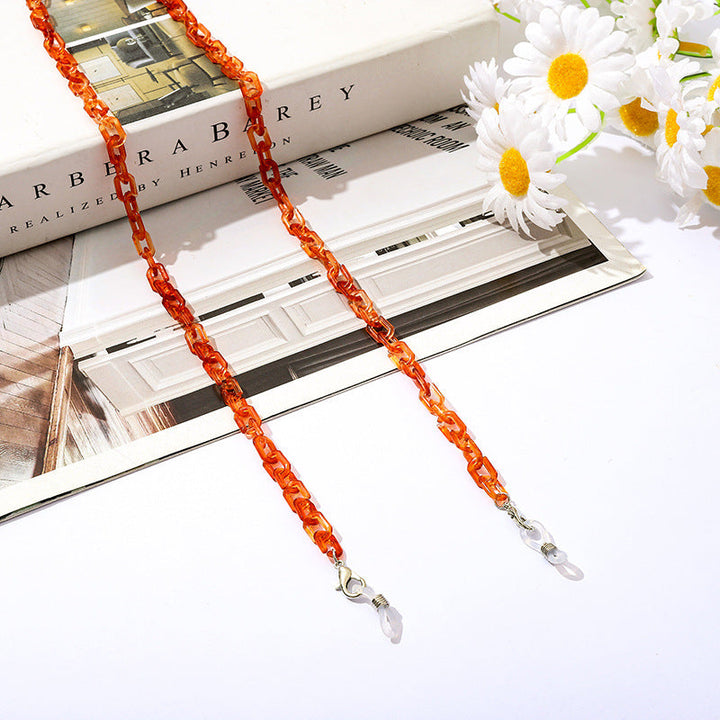 Modern lifestyle accessory: clip clasp chain for securing masks and glasses.
