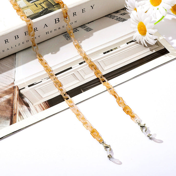 Fashionable mask and glasses holder chain with reliable, easy-to-use clip clasps.