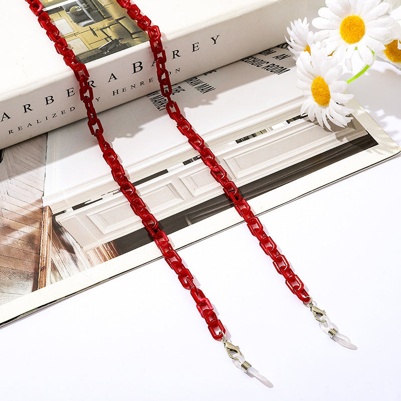 Fashion accessory: sleek chain for glasses, also functions as a face mask strap.
