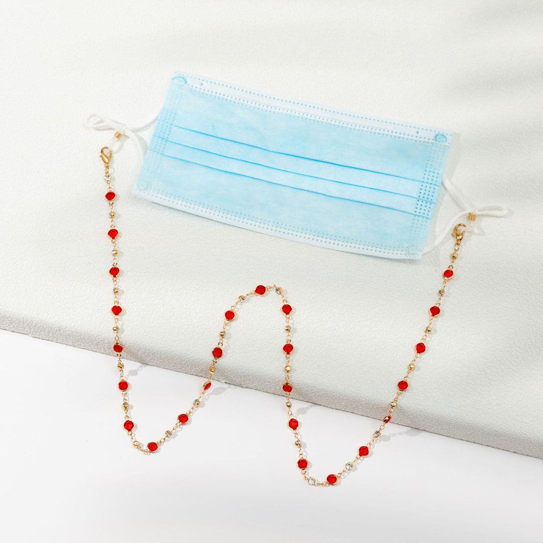 Elegant gold-tone sunglasses chain, a decorative glasses holder for sophisticated eyewear.