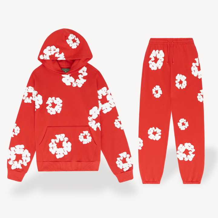 Full-body view of a model wearing a complete unisex floral graphic hoodie and jogger tracksuit set.