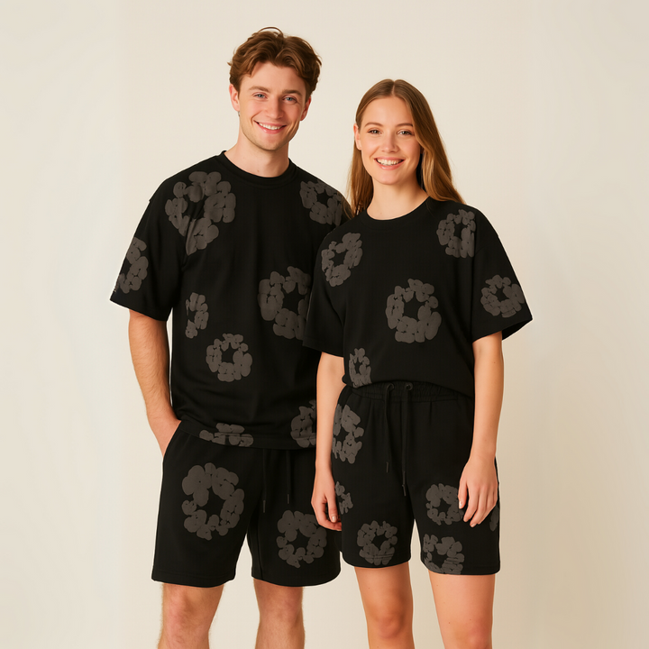 Relaxed fit unisex floral tee and shorts set. Vibrant summer print for comfortable casual wear.