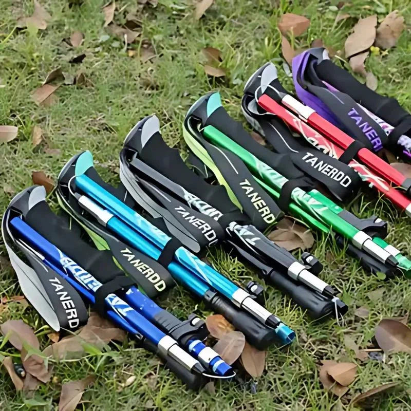 Ergonomic grip of a unisex foldable aluminum trekking pole for comfortable hiking.