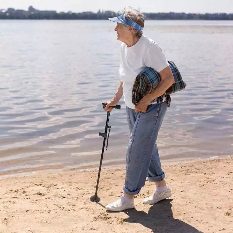 Adjustable foldable walking cane with bright LED light & non-slip foot. Portable mobility aid for stability & safety.