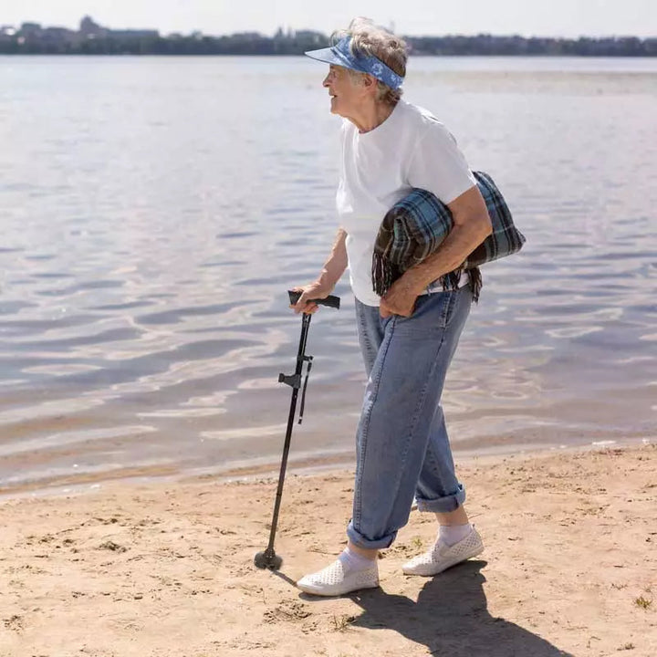 Adjustable foldable walking cane with bright LED light & non-slip foot. Portable mobility aid for stability & safety.